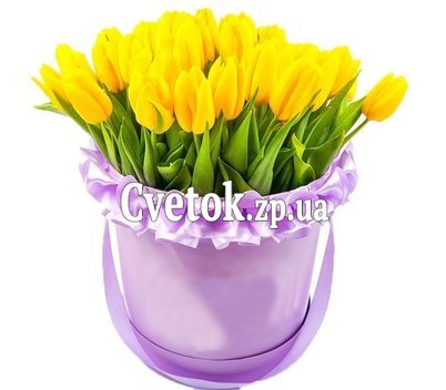 Желтые тюльпаны в круглой коробке